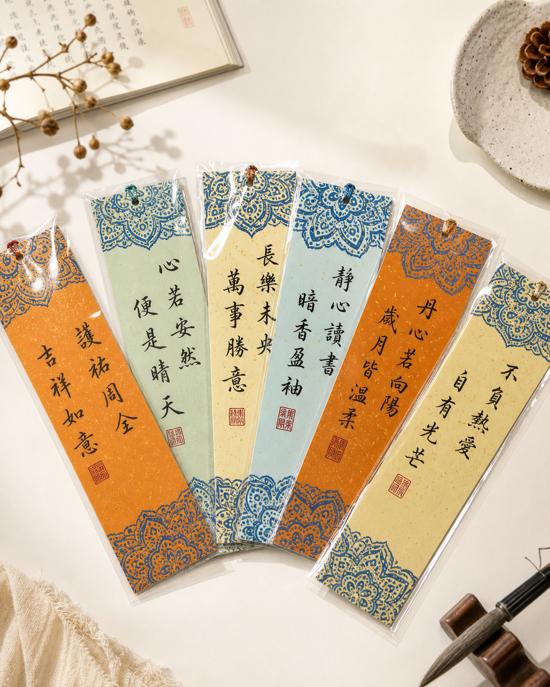 Three handmade calligraphy bookmarks with a ruler reference